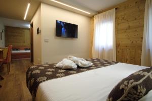 Postel nebo postele na pokoji v ubytování Hotel Granta Parey