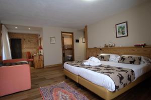 Säng eller sängar i ett rum på Hotel Granta Parey