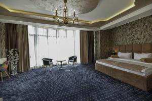 Voodi või voodid majutusasutuse Welcome Inn Hotel toas