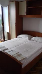 Postel nebo postele na pokoji v ubytování Apartmani Infinity