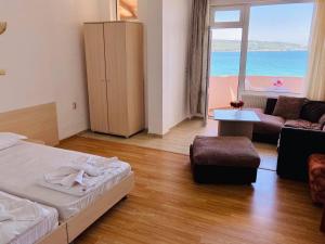 A bed or beds in a room at Plovdiv Hotel