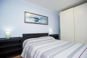 Posteľ alebo postele v izbe v ubytovaní Bilocale Silvia con vista mare - Goelba