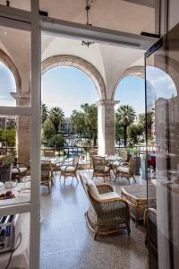 a patio with chairs and tables in a building at La Plaza Arequipa Hotel Boutique in Arequipa