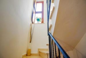 a stairway with a window and a stair case at Casa TerraSun in Silvi Paese