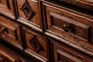 a close up of a wooden cabinet door at Casa Barbabuc in Novello