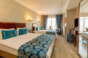 Postel nebo postele na pokoji v ubytování Rast Hotel Sultanahmet