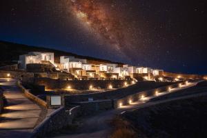 a city at night with the milky way at Belvedere in Livadi