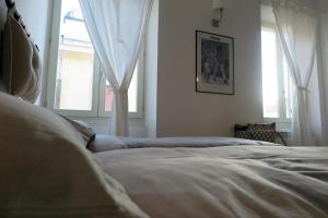 Postel nebo postele na pokoji v ubytování Affittacamere Casa Cavour