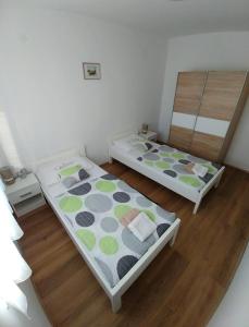 Postel nebo postele na pokoji v ubytování Apartmani Valuna