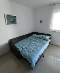 Postel nebo postele na pokoji v ubytování Apartmani Valuna