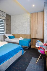 Postel nebo postele na pokoji v ubytování Garni hotel King