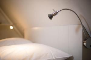 Postel nebo postele na pokoji v ubytování Haus Weesterhuk Whg 8