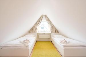 Кровать или кровати в номере Haus Nordgang 8 Haushaelfte B
