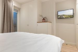 Ein Bett oder Betten in einem Zimmer der Unterkunft Süster Hüs