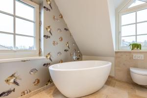 Ein Badezimmer in der Unterkunft Süster Hüs
