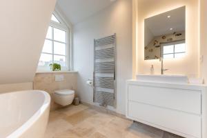 Ein Badezimmer in der Unterkunft Süster Hüs