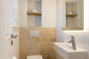 Ein Badezimmer in der Unterkunft Süster Hüs