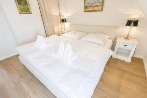 Postel nebo postele na pokoji v ubytování Landhaus Tinnumburg
