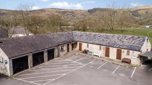 an overhead view of a building with a parking lot at Cheshire Mews in Castleton