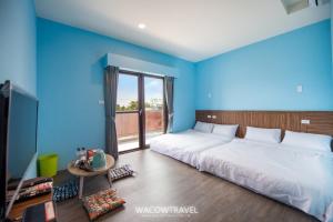 Llit o llits en una habitació de 我們這一家輕旅宿