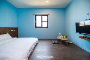 Llit o llits en una habitació de 我們這一家輕旅宿