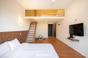 Llit o llits en una habitació de 我們這一家輕旅宿