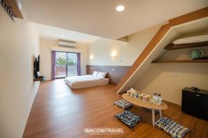 Llit o llits en una habitació de 我們這一家輕旅宿