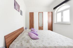 Postel nebo postele na pokoji v ubytování Apartments Ines