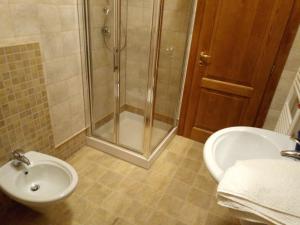 a bathroom with a shower and a sink and a toilet at A CASA DI LUCA E GLORIA 2 in Giulianova