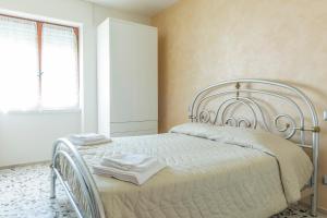 Postel nebo postele na pokoji v ubytování B&B Alba sul Mare Guest House