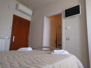Postel nebo postele na pokoji v ubytování B&B Alba sul Mare Guest House
