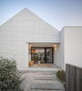 a white house with a gray roof at Manos 114 in Comporta