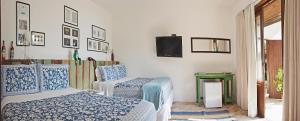 Katil atau katil-katil dalam bilik di Hotel Boutique Ananas