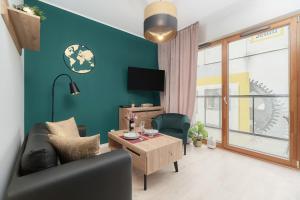 Кът за сядане в Apartment Wrocław Na Bulwarach by Renters