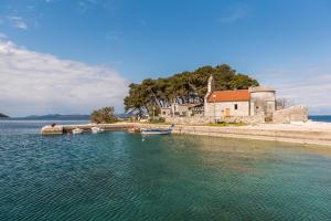 a group of boats in a body of water at Apartment Anita in Savar