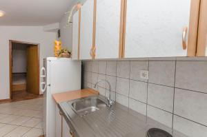 a kitchen with a sink and a counter at Apartments Villa Estella in Srima +50 photos