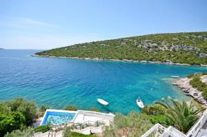 a view of a beach with boats in the water at Villa Sine in Sevid