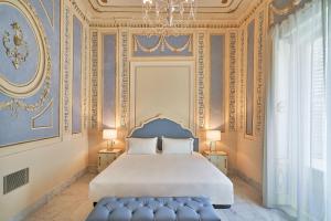 Postel nebo postele na pokoji v ubytování Tandem Palacio Veedor de Galeras Suites