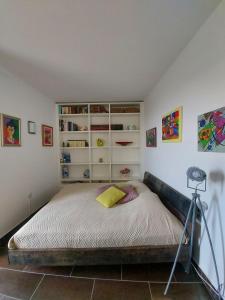 a bedroom with a bed with a tripod in it at Apartma Viktorija in Portorož