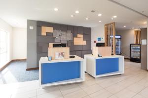 a store with boxes on the counters in a room at Holiday Inn Express Hotel & Suites Logansport, an IHG Hotel in Logansport