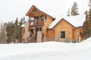 a log home in the snow with snow at Default in Breckenridge