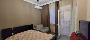 Postel nebo postele na pokoji v ubytování Guest House Kldiashvili