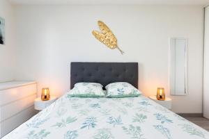 Ένα ή περισσότερα κρεβάτια σε δωμάτιο στο Appartement tout confort - Pau Nord