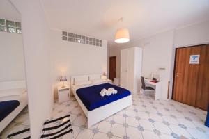 Posteľ alebo postele v izbe v ubytovaní Casa Adele b&b