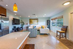 a kitchen and living room with a couch and a table at Highland Beach Retreat- Short walk to beach in Highland Beach
