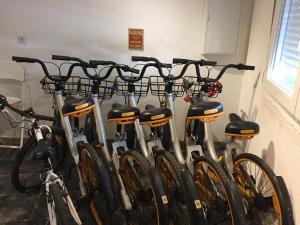 a group of bikes parked next to each other at ASV Apartments in Pineda de Mar