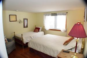 Letto o letti in una camera di The Inn at Quail Run