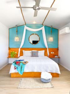 A bed or beds in a room at Ocean Escape Resort & Spa