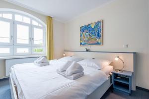 Giường trong phòng chung tại Residenz Bismarck Whg 3 +26 ảnh