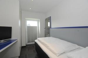 Postel nebo postele na pokoji v ubytování Haus Schuetzenstrasse Whg 4